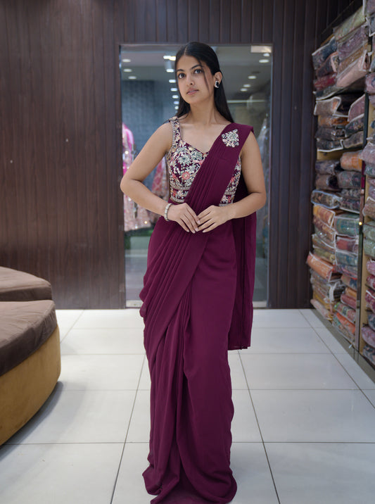Woman wearing a mehroon ready-to-wear pre-draped saree